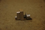 Boss installed into block. The top of the hole for the boss is located at the center of the axle. This is so that the location of the top of the boss does not change as the axle is rotated.  