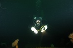 White gloves, white face, black suit