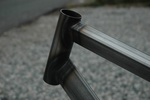 Closeup of head tube that shows off the shaped top tube and down tube.