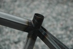 Closeup of seat tube showing the lines of the shaped top tube and seat stays.